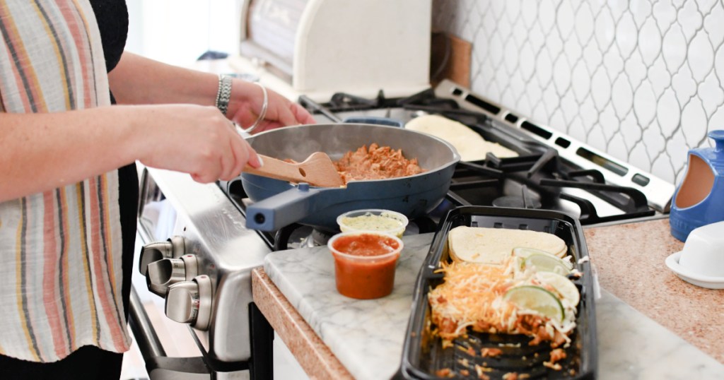 woman cooking sam's club taco kit