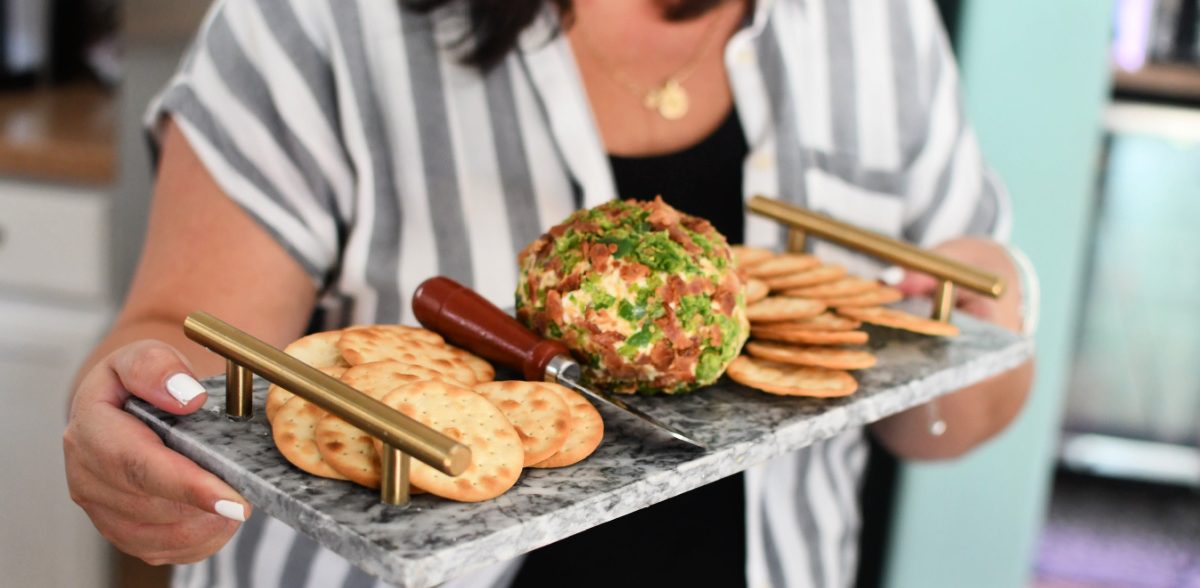 woman holding an appetizer tray