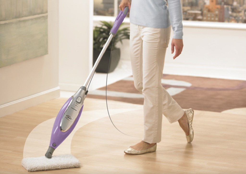 woman using shark steam mop