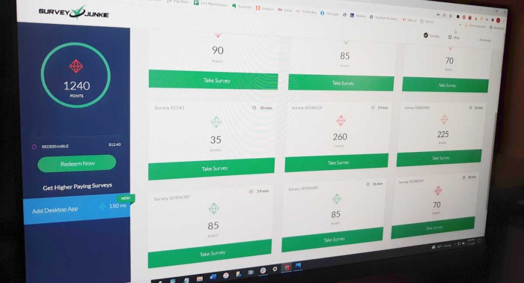 Survey Junkie dashboard on desktop computer