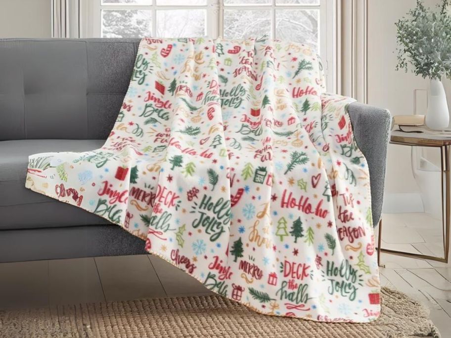 Birch Trail Holiday Printed Fleece Throw Blanket on couch