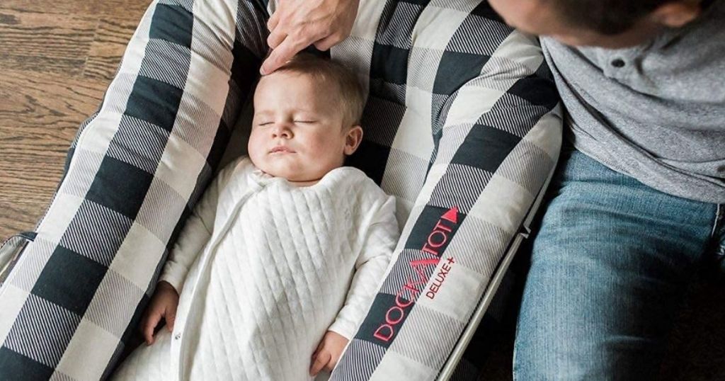 baby is white and black DockATot