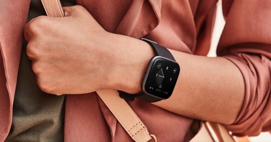 persons wrist showing off a black watch