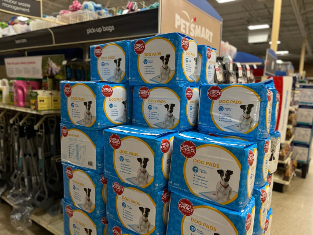 large stack of boxes with dog pads in them inside store