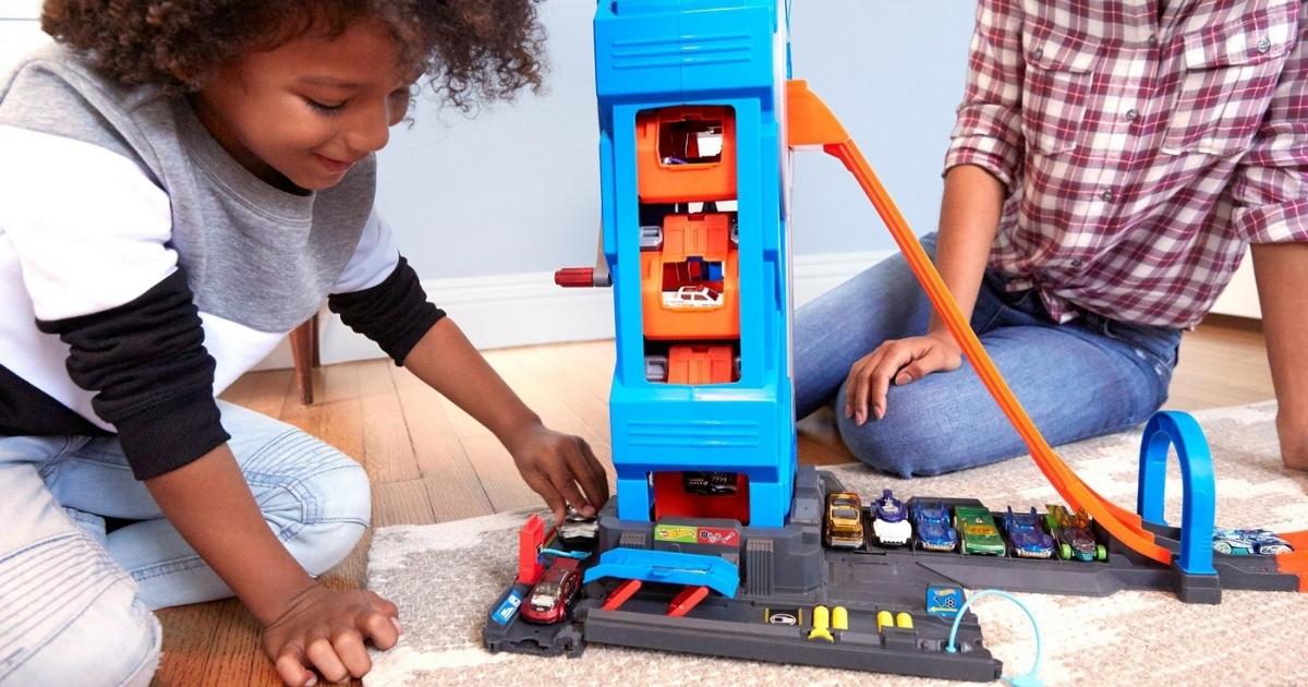 child playing with hot wheels mega garage