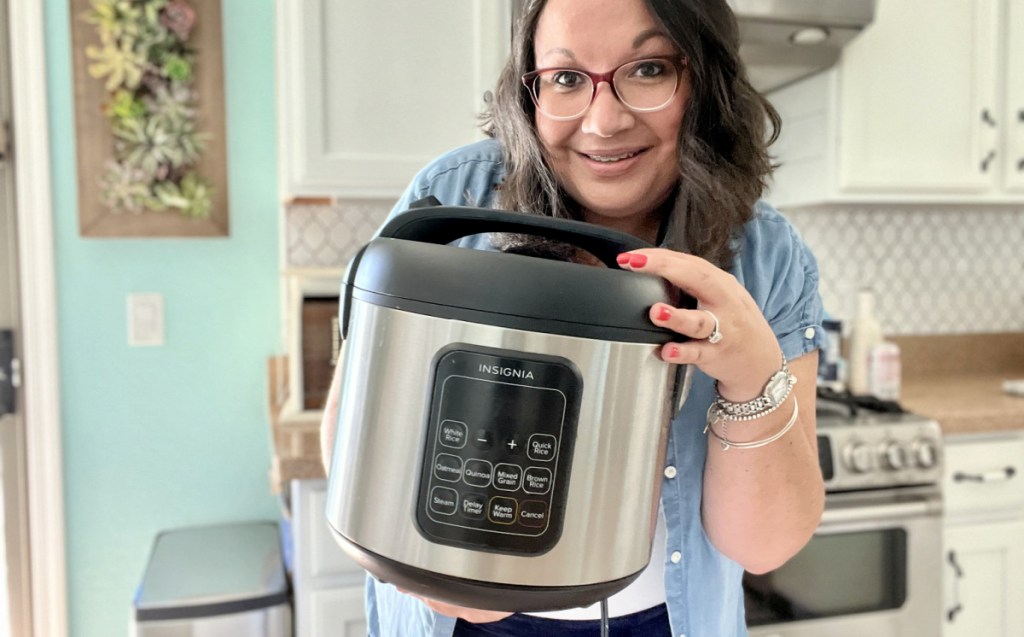 woman holding a rice cooker 