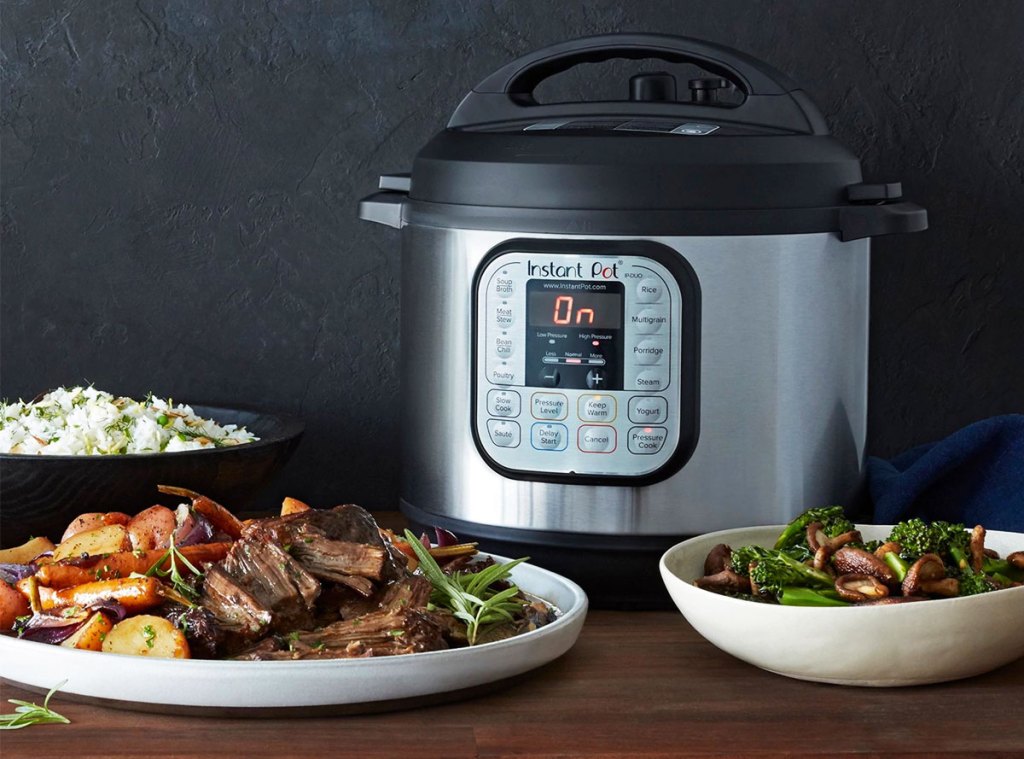 instant pot mini multi cooker with plates of food