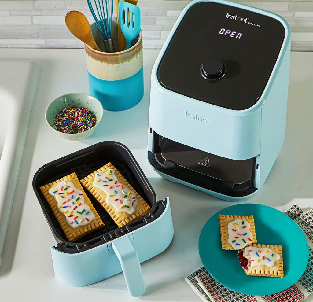 blue mini air fryer cooking pastries