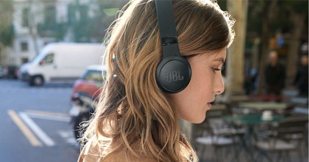 woman wearing black JBL Headphones