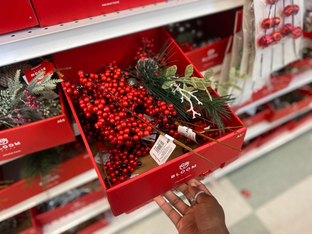 woman pulling out box of Joann Floral Picks