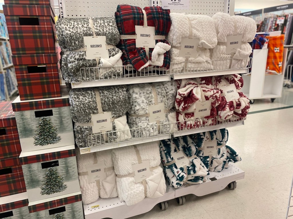 Joann Hudson 43 Throw Pillows on store display