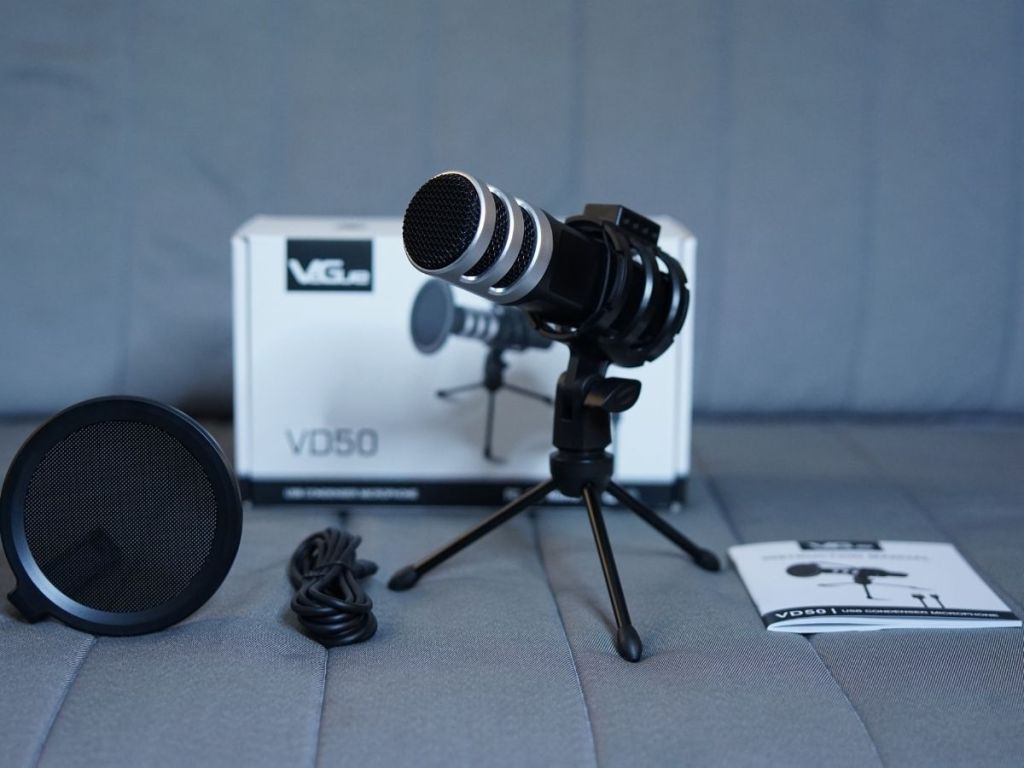 Microphone on tripod with package standing behind it