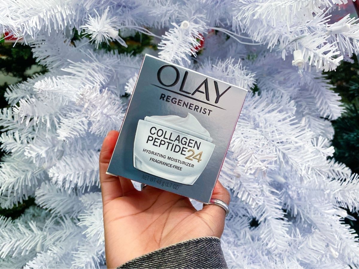 hand holding olay collagen peptide 24 moisturizer 