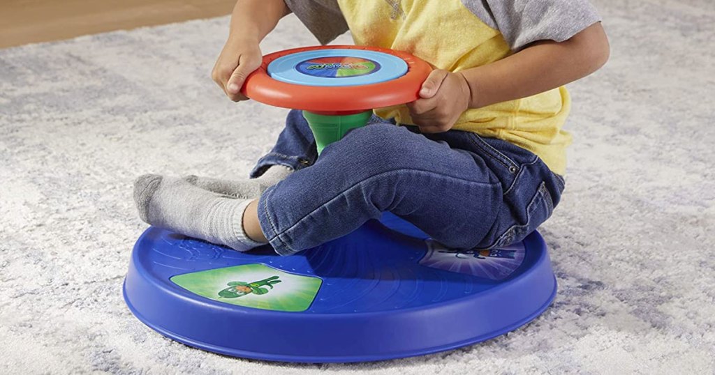 toddler on a sit n spin toy