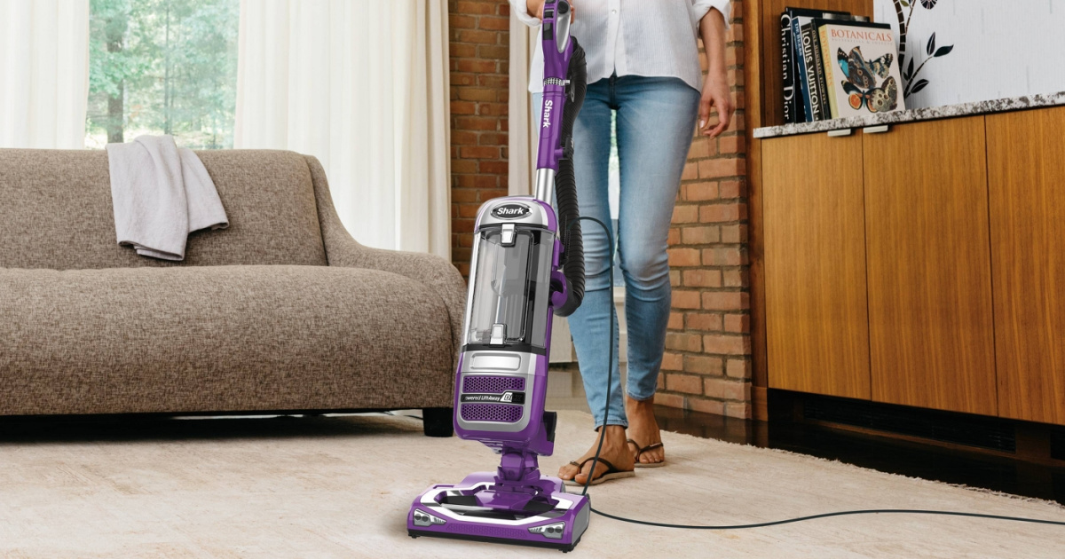 woman vacuuming living room floor