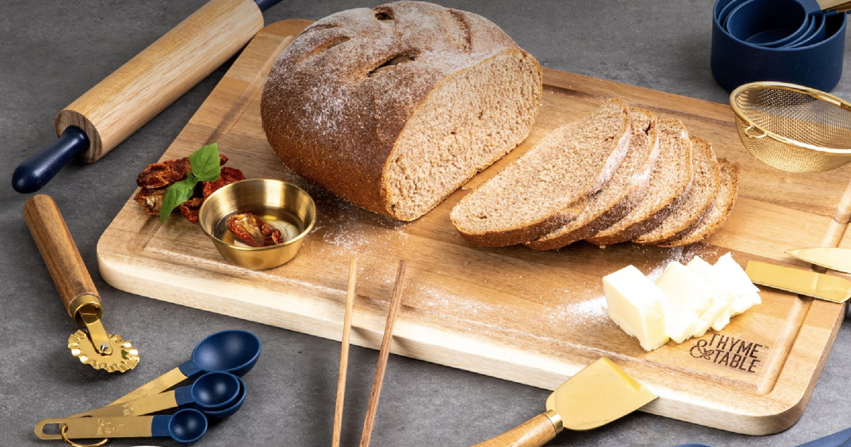 baking set with loaf of bread on cutting board