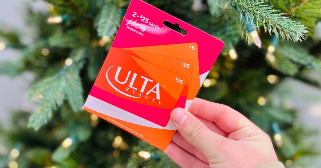 ULTA gift card in hand near christmas tree