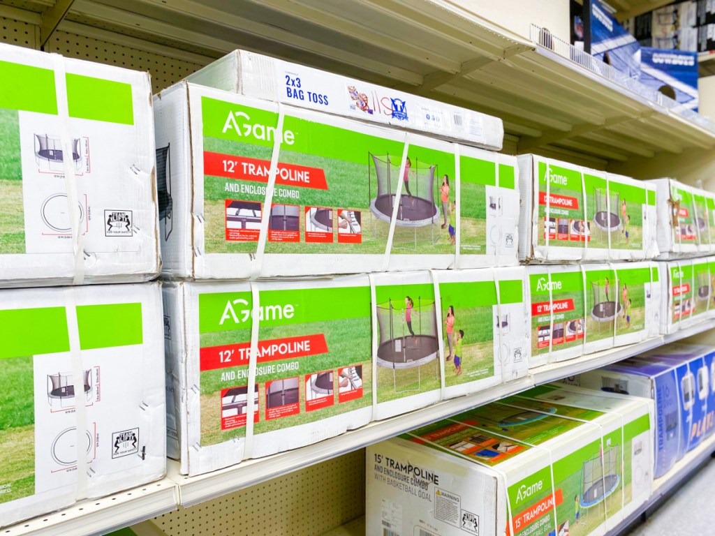 store shelf with boxes containing trampolines