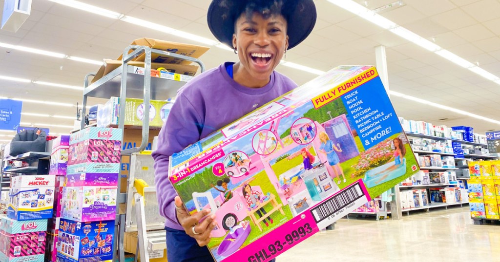 woman holding a barbie dreamcamper box