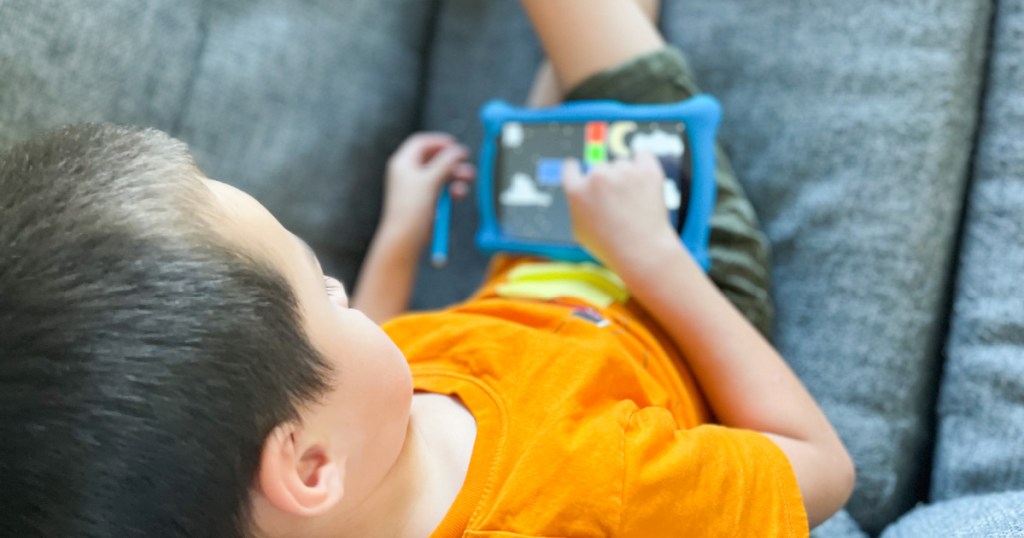 boy playing contixo tablet