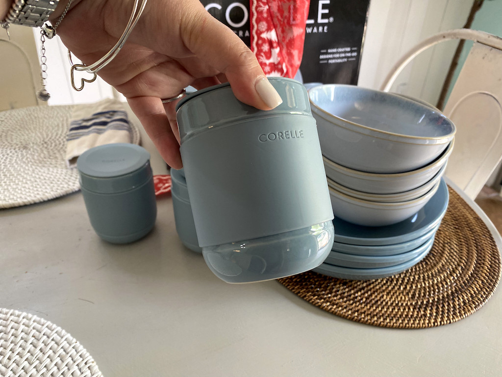 holding Corelle coffee tumbler 