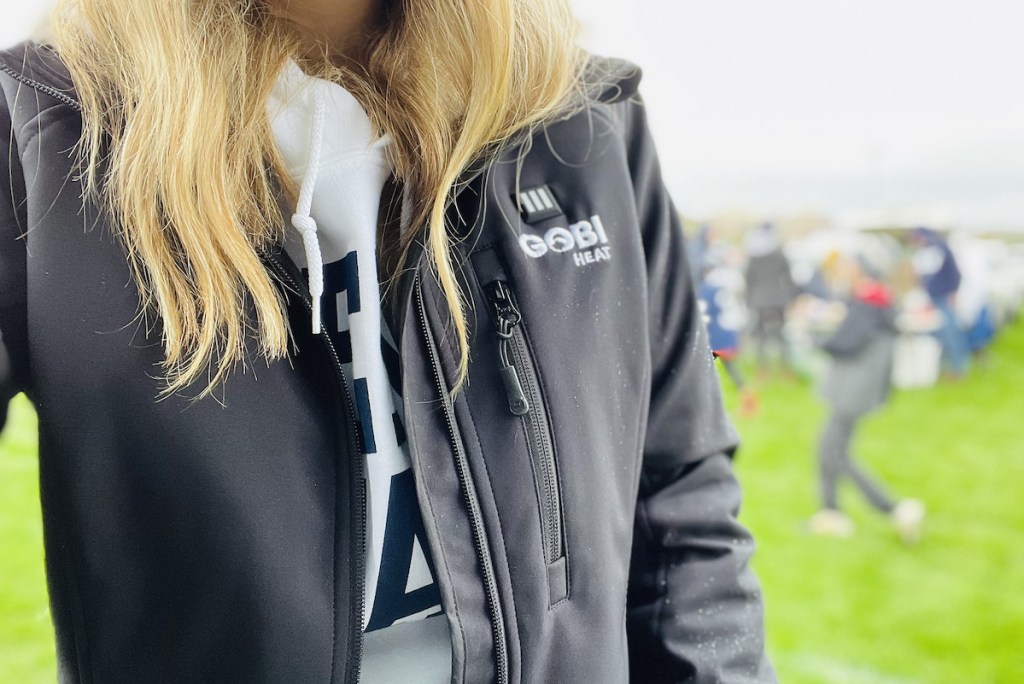 woman wearing black gobi heat jacket with white penn state sweatshirt