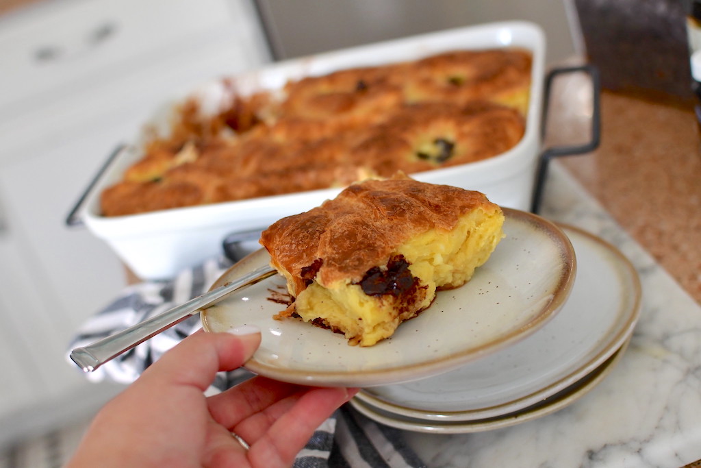 holding croissant bread pudding on a plate