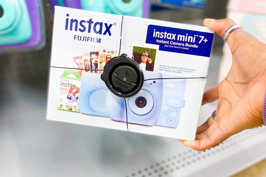 holding fujifilm instax mini bundle