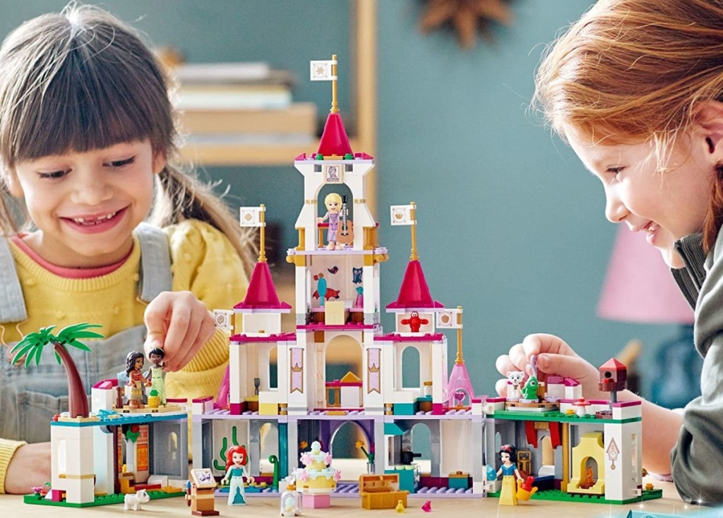 girls building a LEGO castle