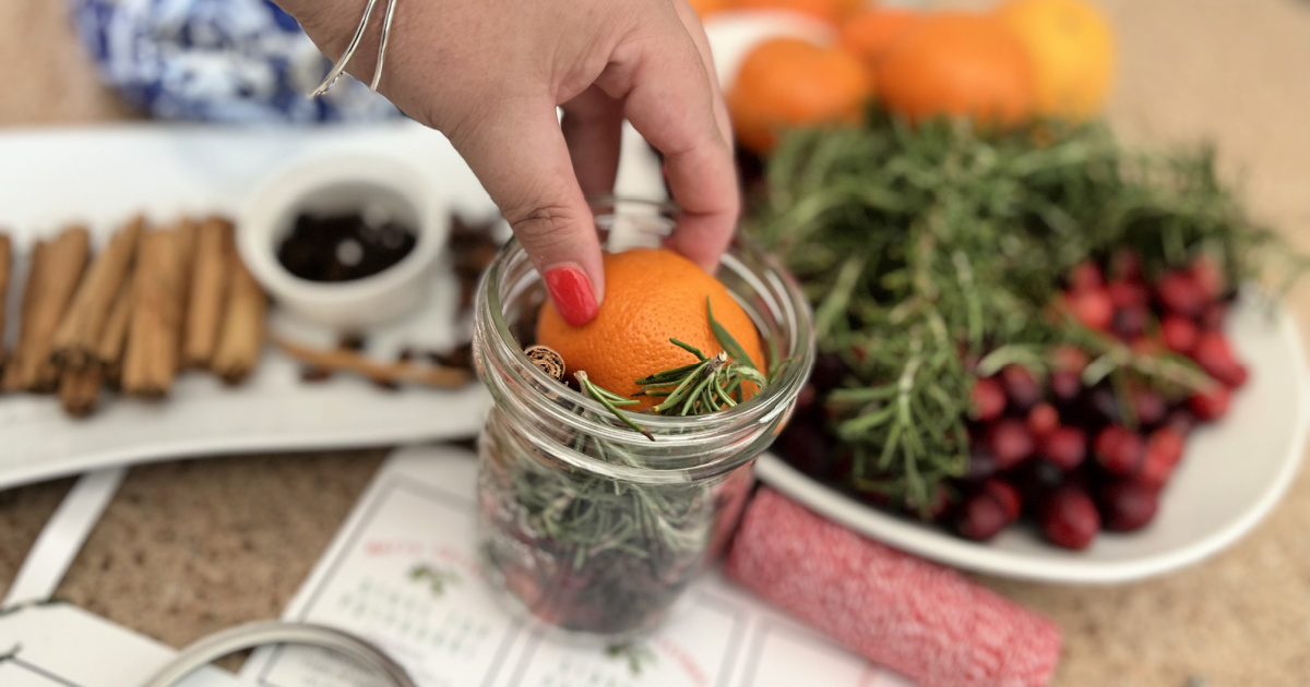 adding rosemary and orange slice