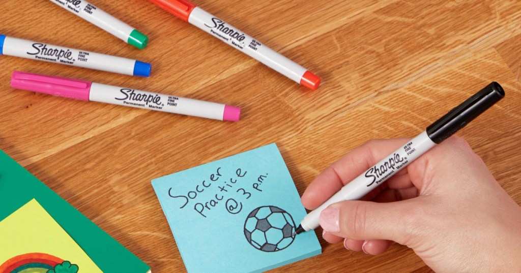 child drawing with a marker