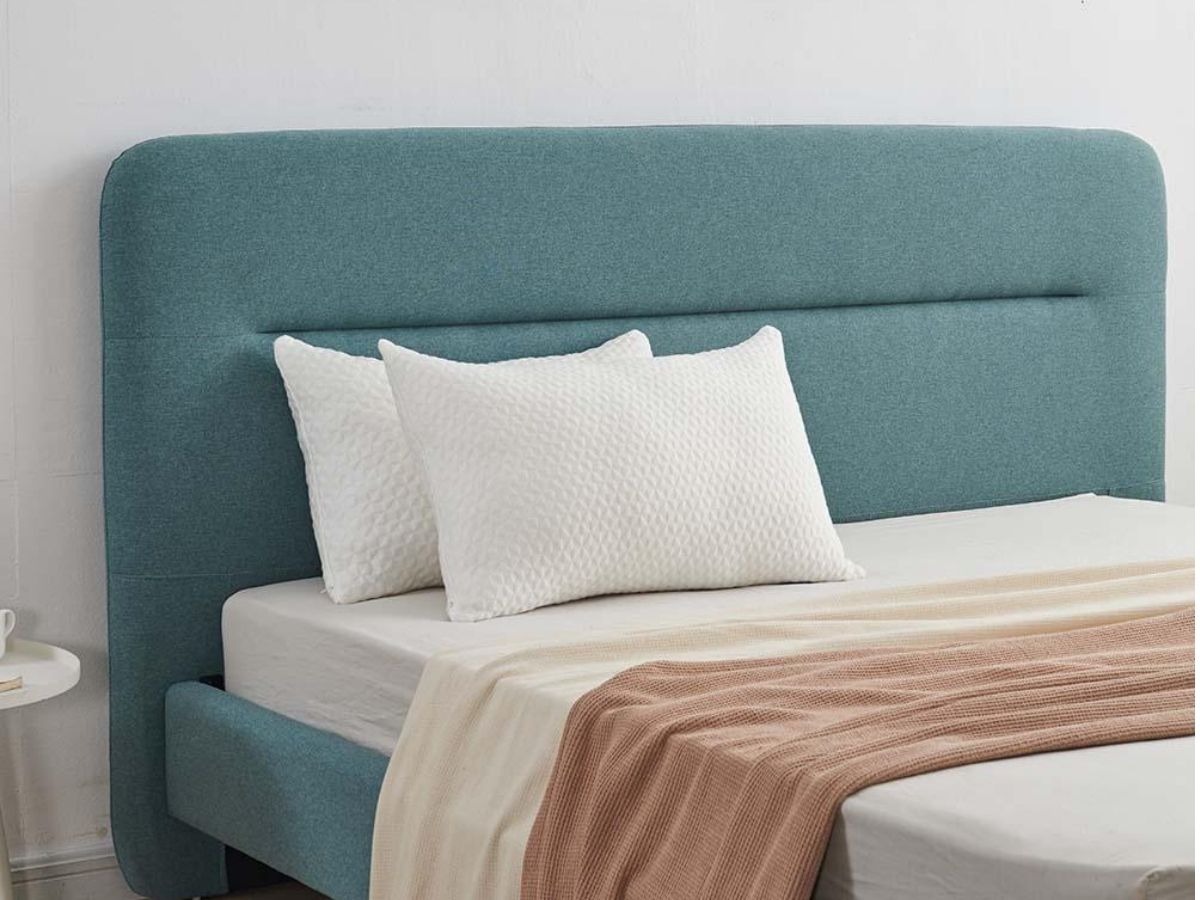 2 white pillows on bed