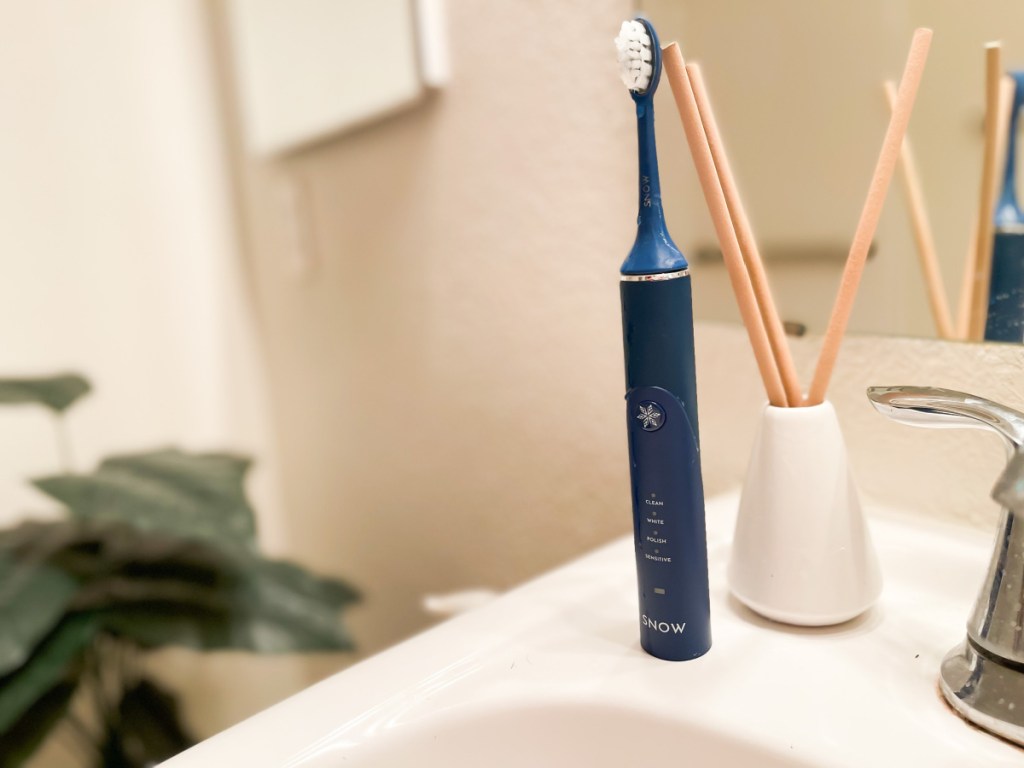 snow toothbrush near sink