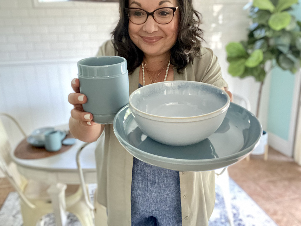 woman holding Corelle stoneware 