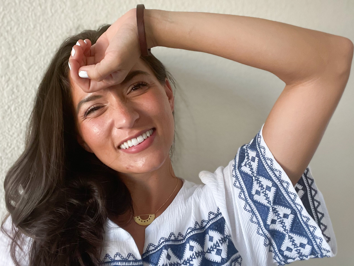 woman wearing starfish project jewelry