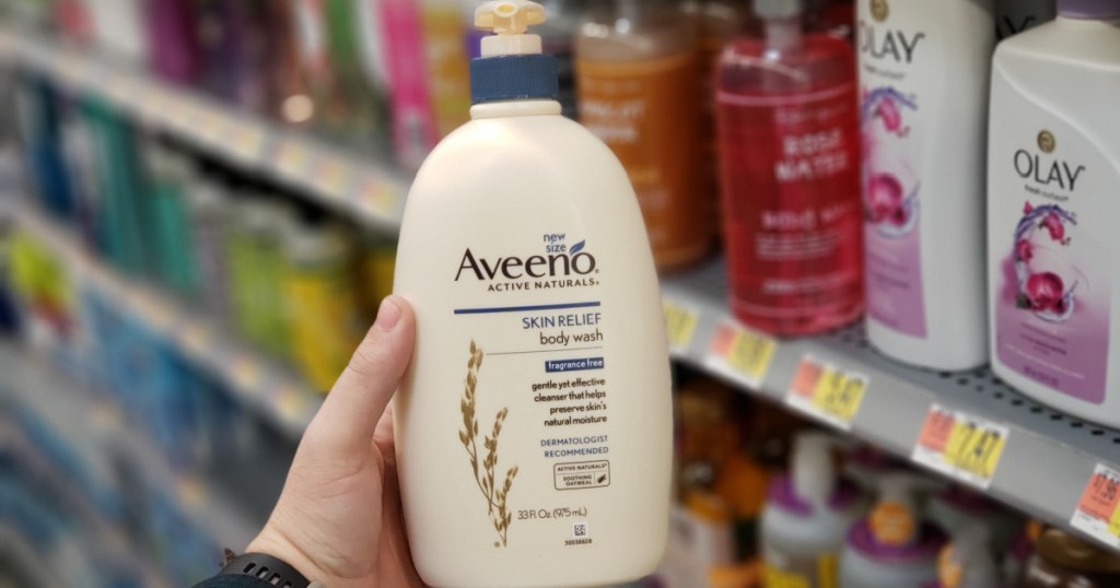 hand holding up big bottle of body wash inside store