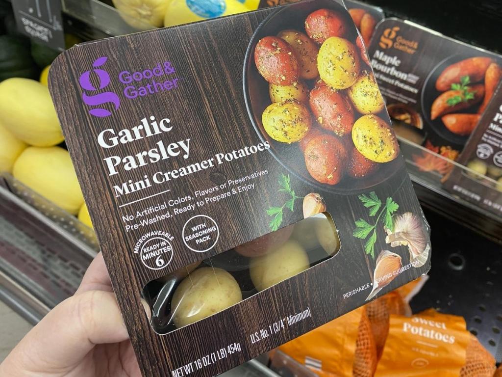 hand holding good & gather garlic parsley mini potatoes in store