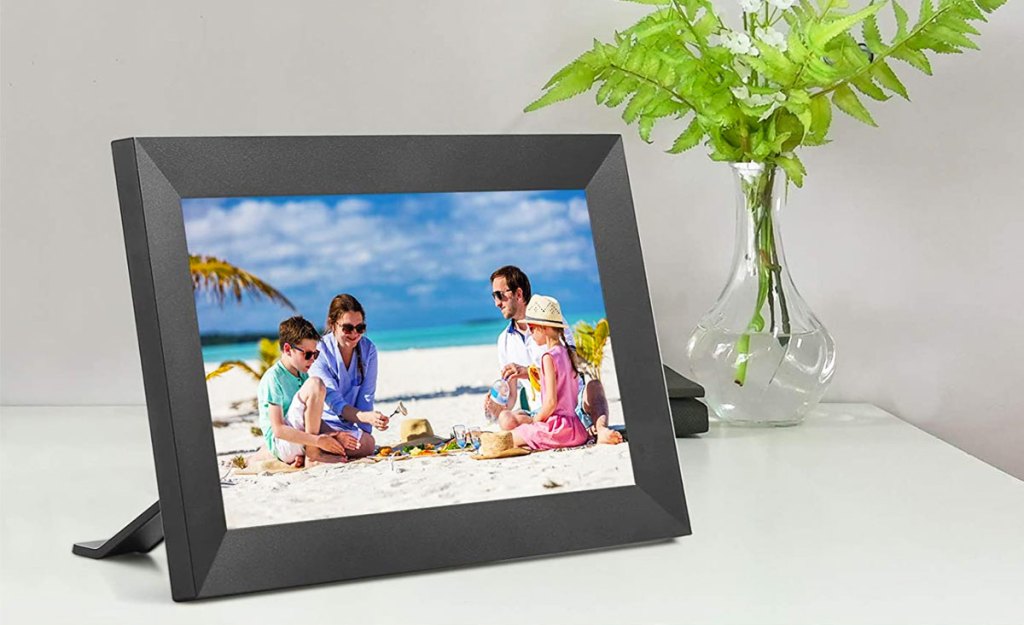 black digital photo frame on table