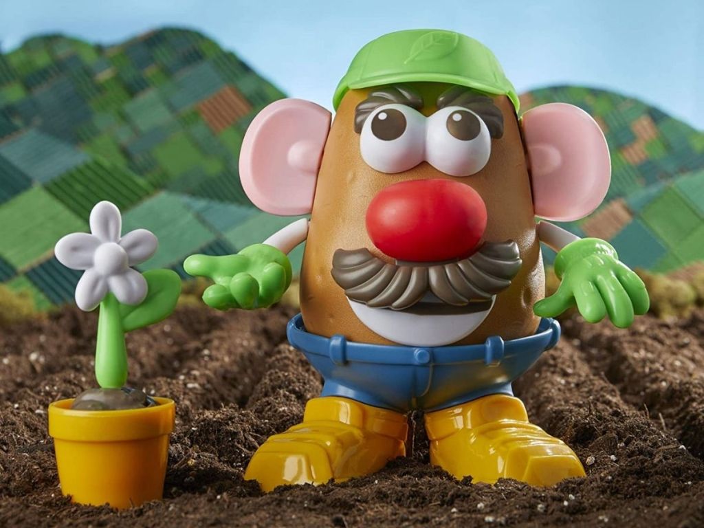 Mr. Potato head goes green standing in dirt 