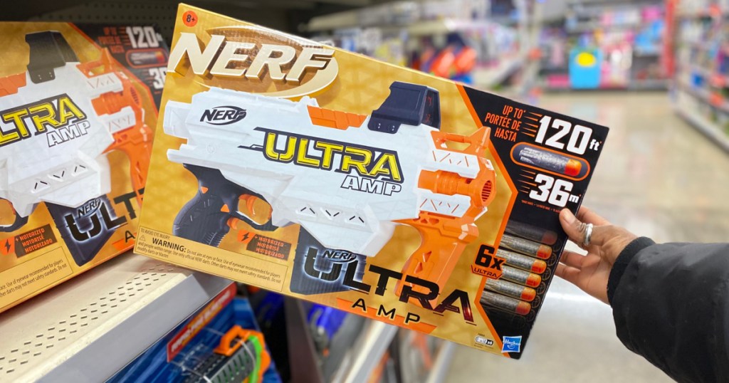 hand pulling NERF set off of store shelf