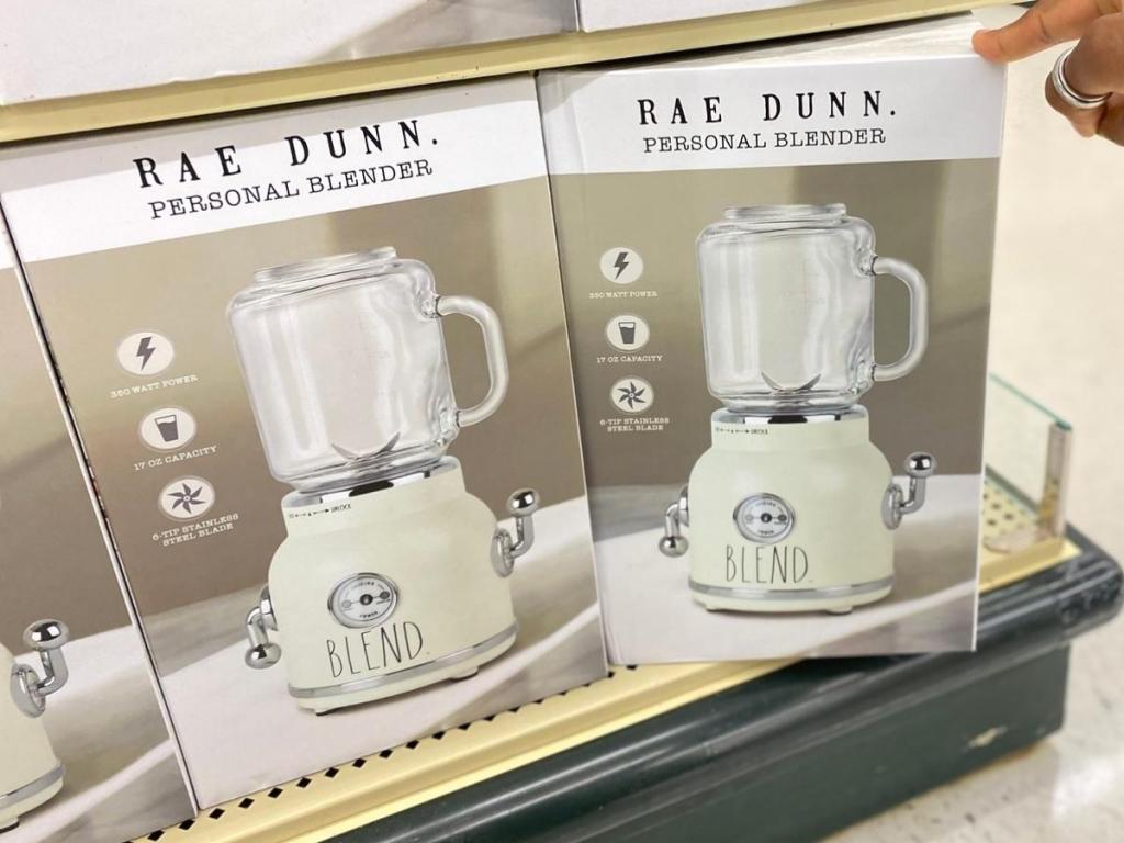 hand holding rae dunn personal blender box