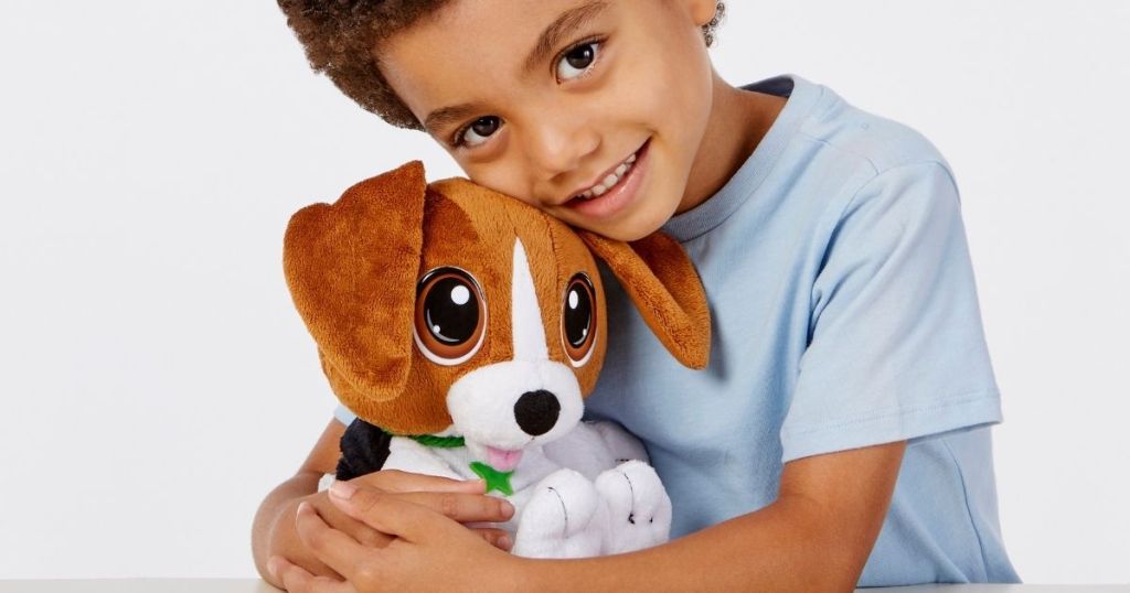 boy hugging plush dog