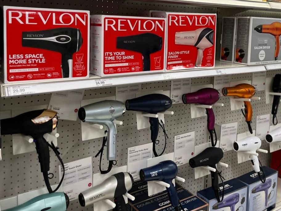 Various hair dryers on a wall