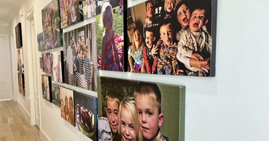 large wall display of photo canvases