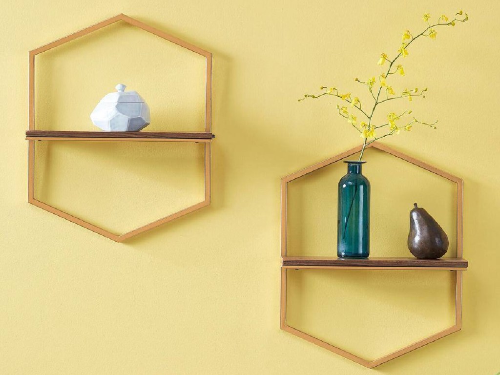 2 hexagon shaped shelves on yellow wall