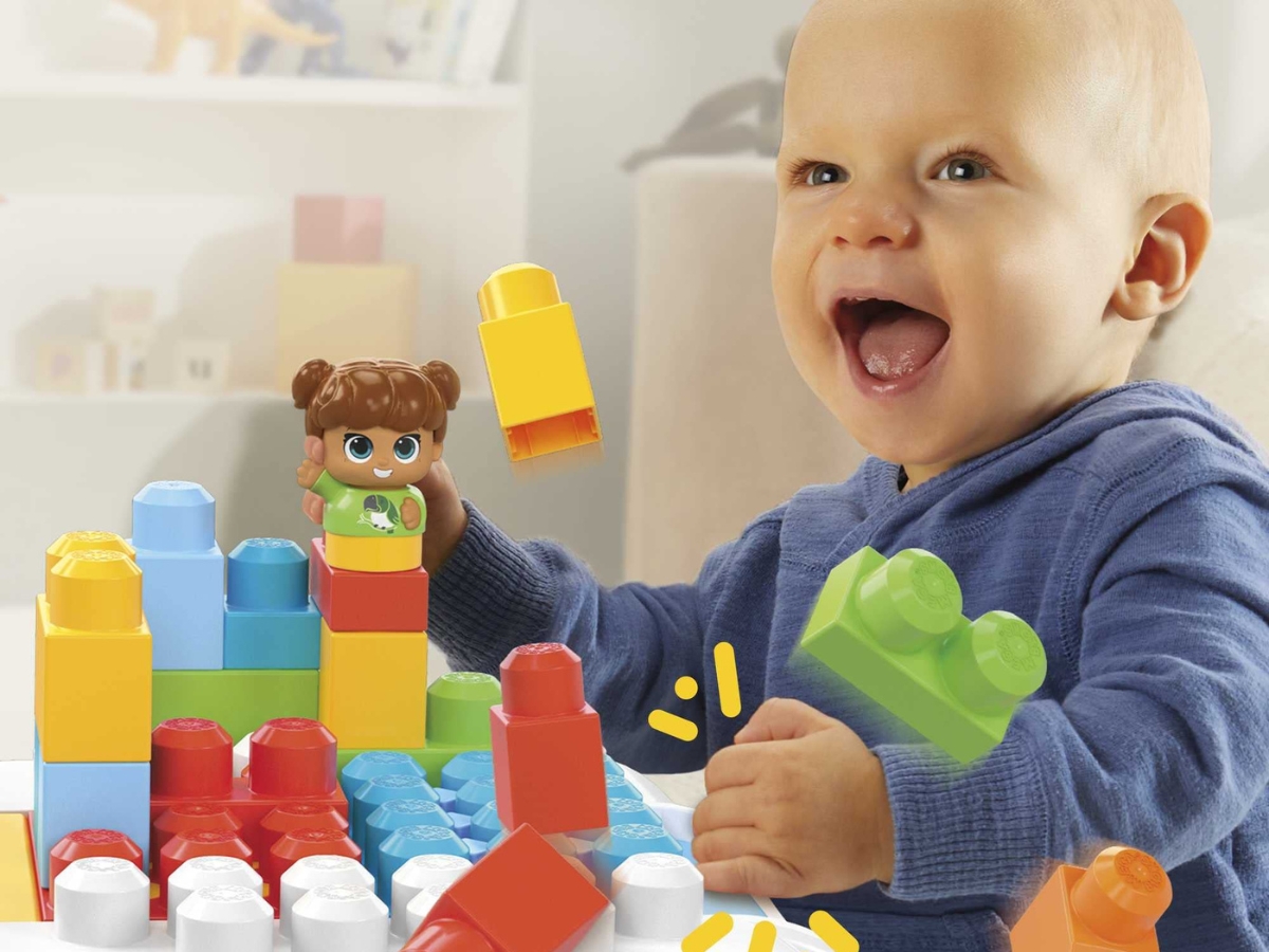 Toddler playing with Mega Bloks Build 'n Learn Table