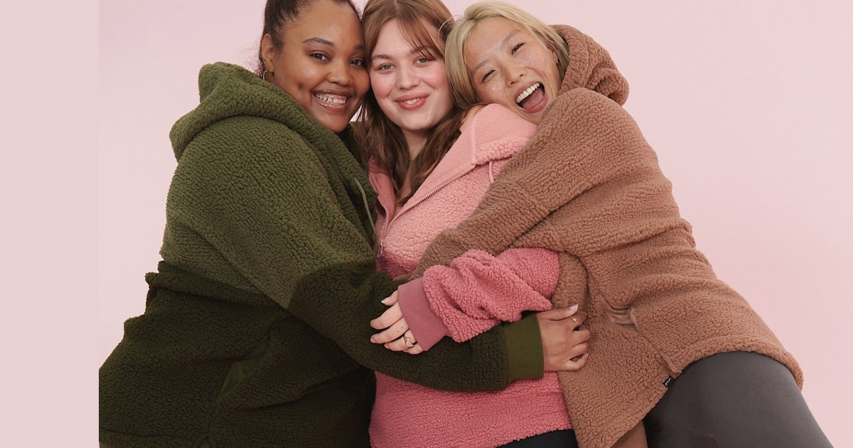 woman in sherpa jackets hugging