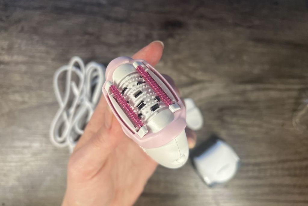 holding a Braun epilator