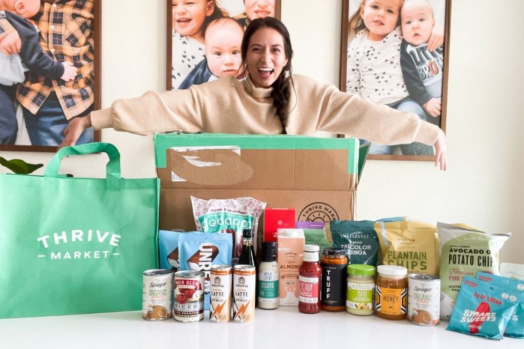 woman standing over Thrive Market order