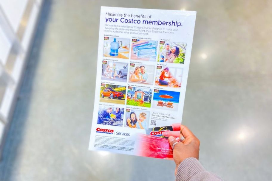 hand holding Costco membership poster